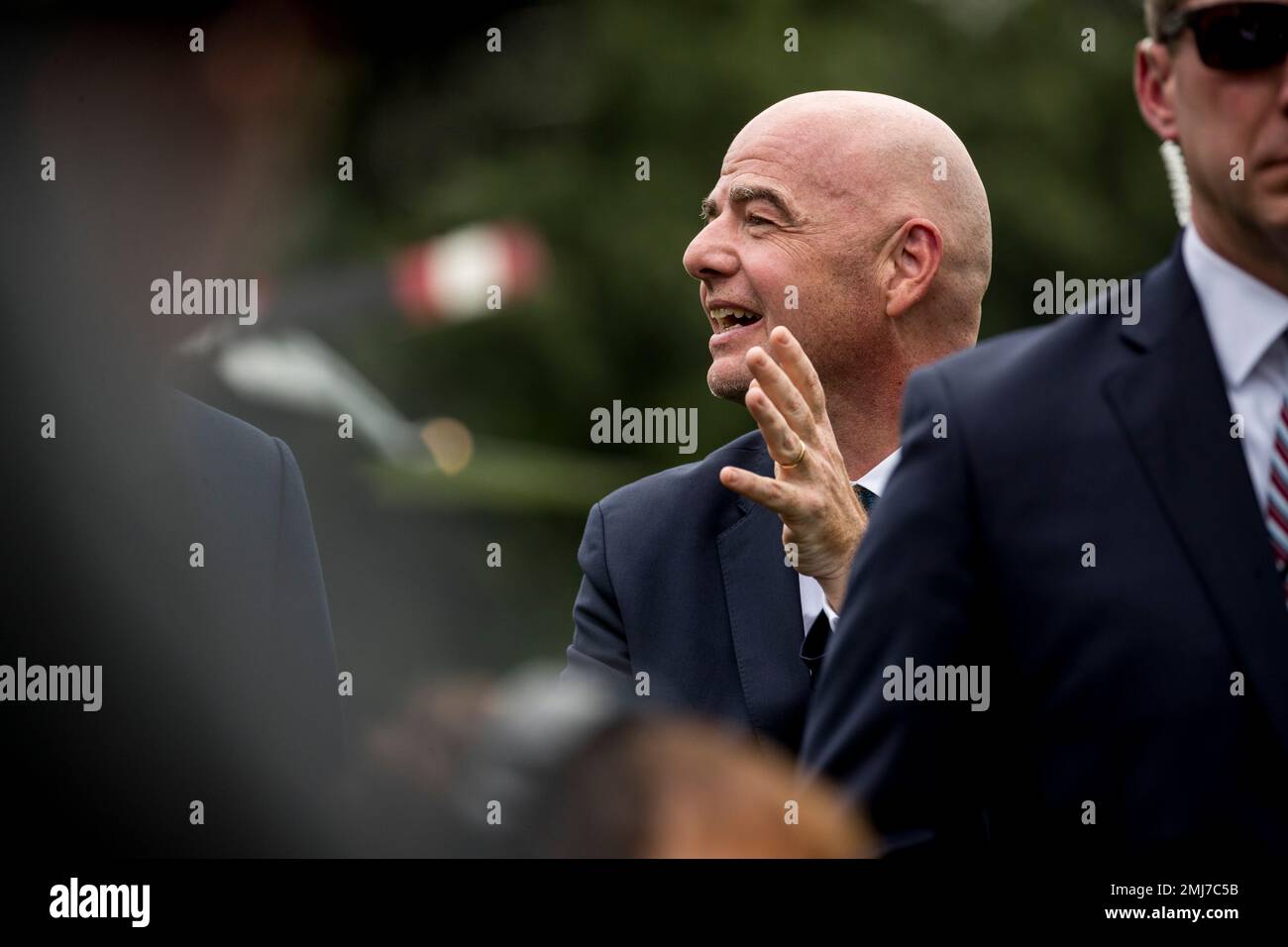 FIFA president Gianni Infantino stands near President Donald Trump as he speaks to members of the media on the South Lawn of the White House in Washington, Monday, Sept. 9, 2019, before Trump boards Marine One for a short trip to Andrews Air Force Base, Md., and then on to North Carolina. (AP Photo/Andrew Harnik) Foto Stock