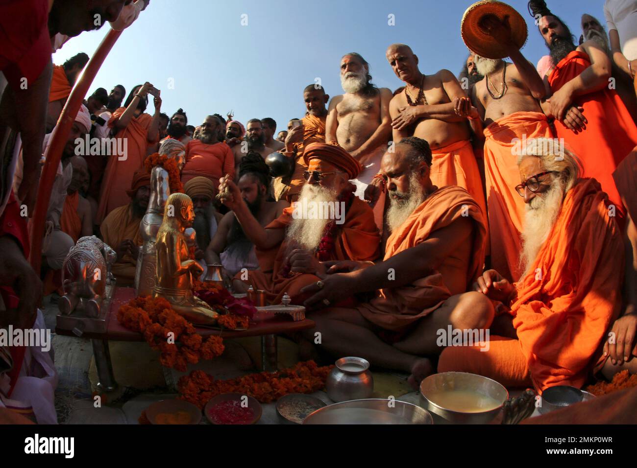 Sadhus, or Hindu holy men, perform rituals before taking a holy dip at ...