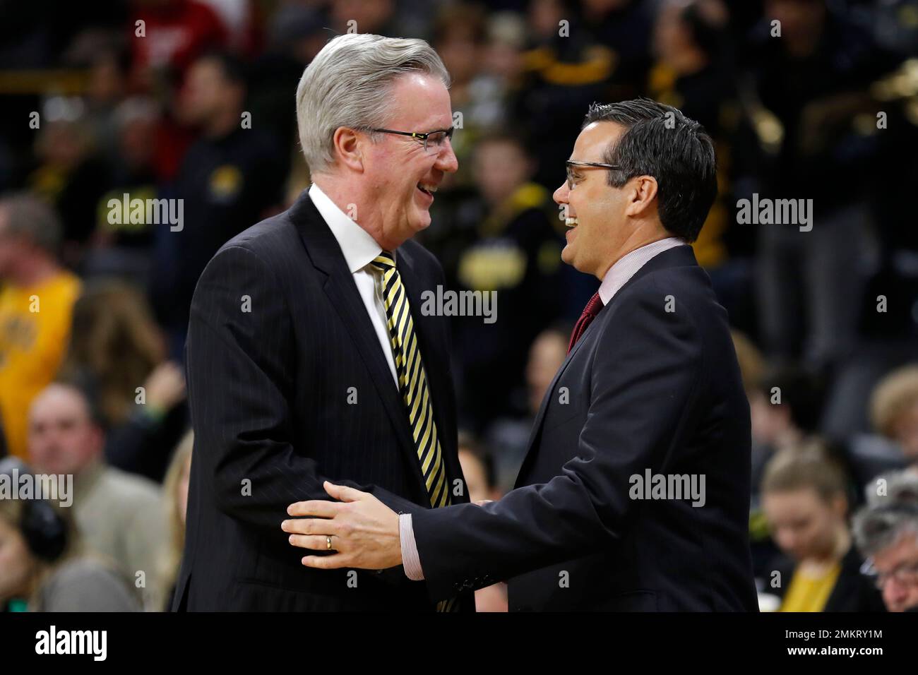 Iowa head coach Fran McCaffery, left, greets Nebraska head coach Tim