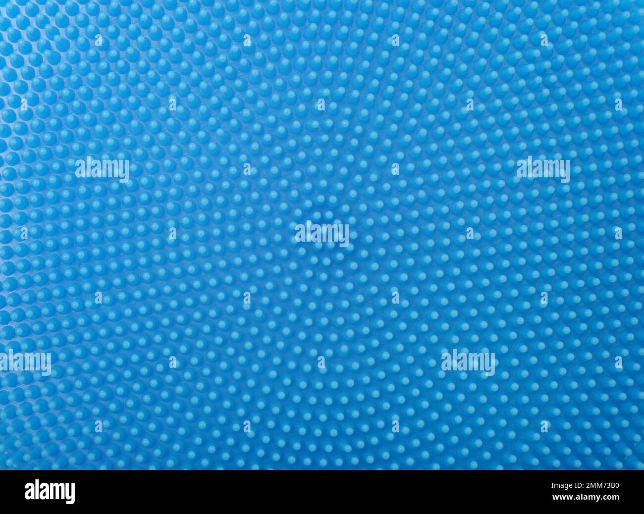 Tappetino in silicone blu con pimples come sfondo. Foto Stock