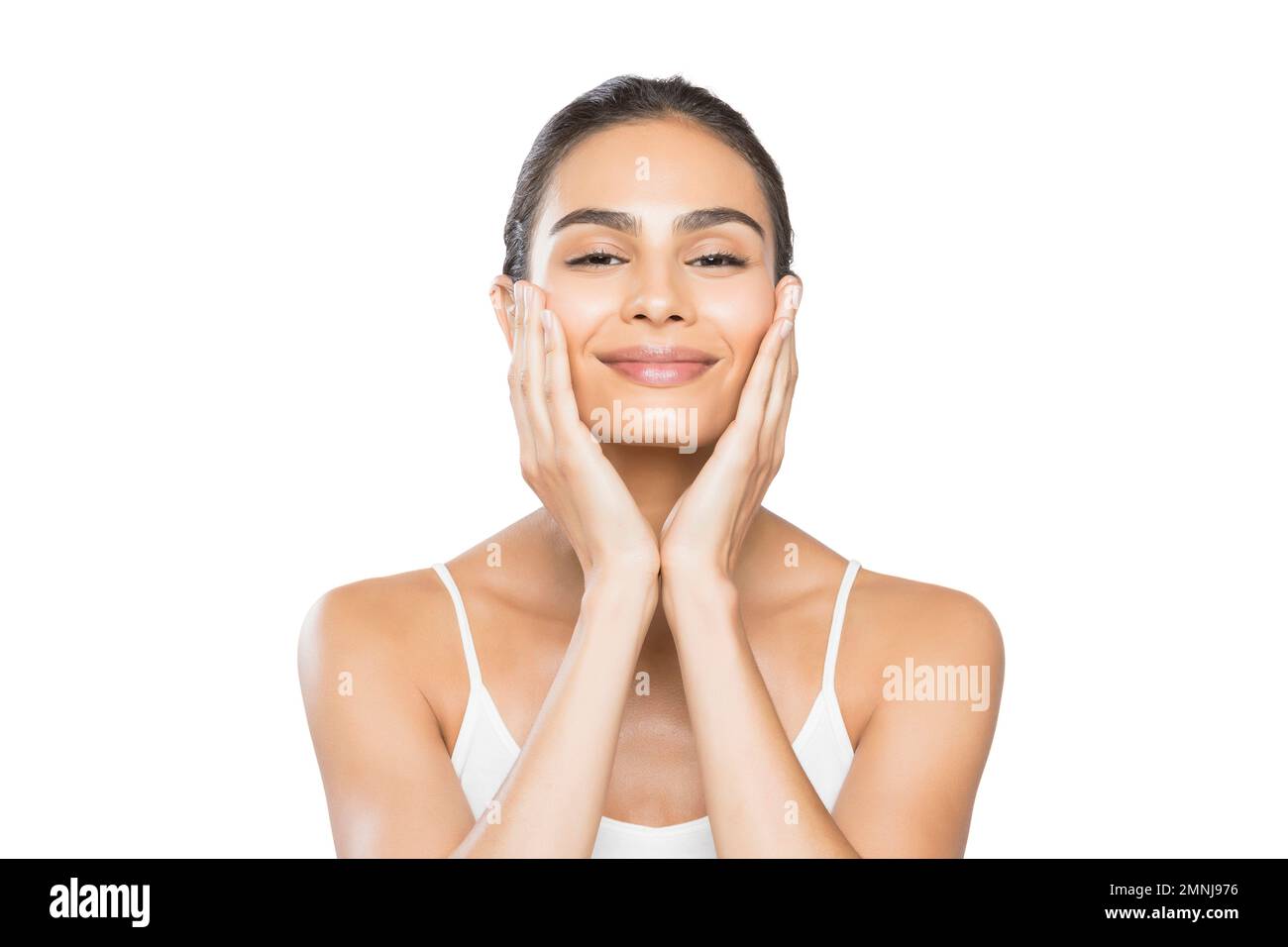 Ritratto di giovane donna sorridente che fa il massaggio facciale Foto Stock