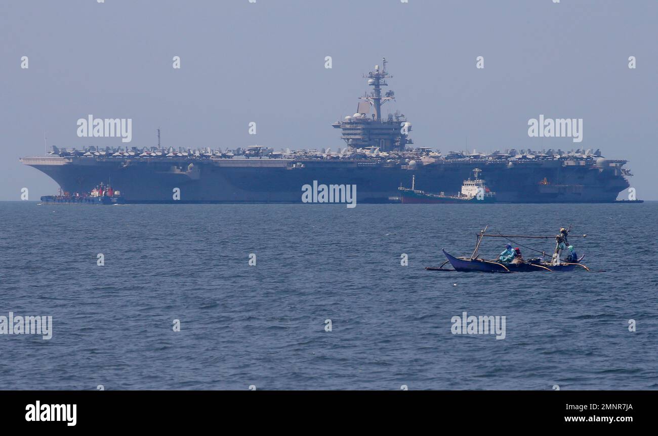 FILE In this Feb. 17, 2018, file photo, fishermen on board a small