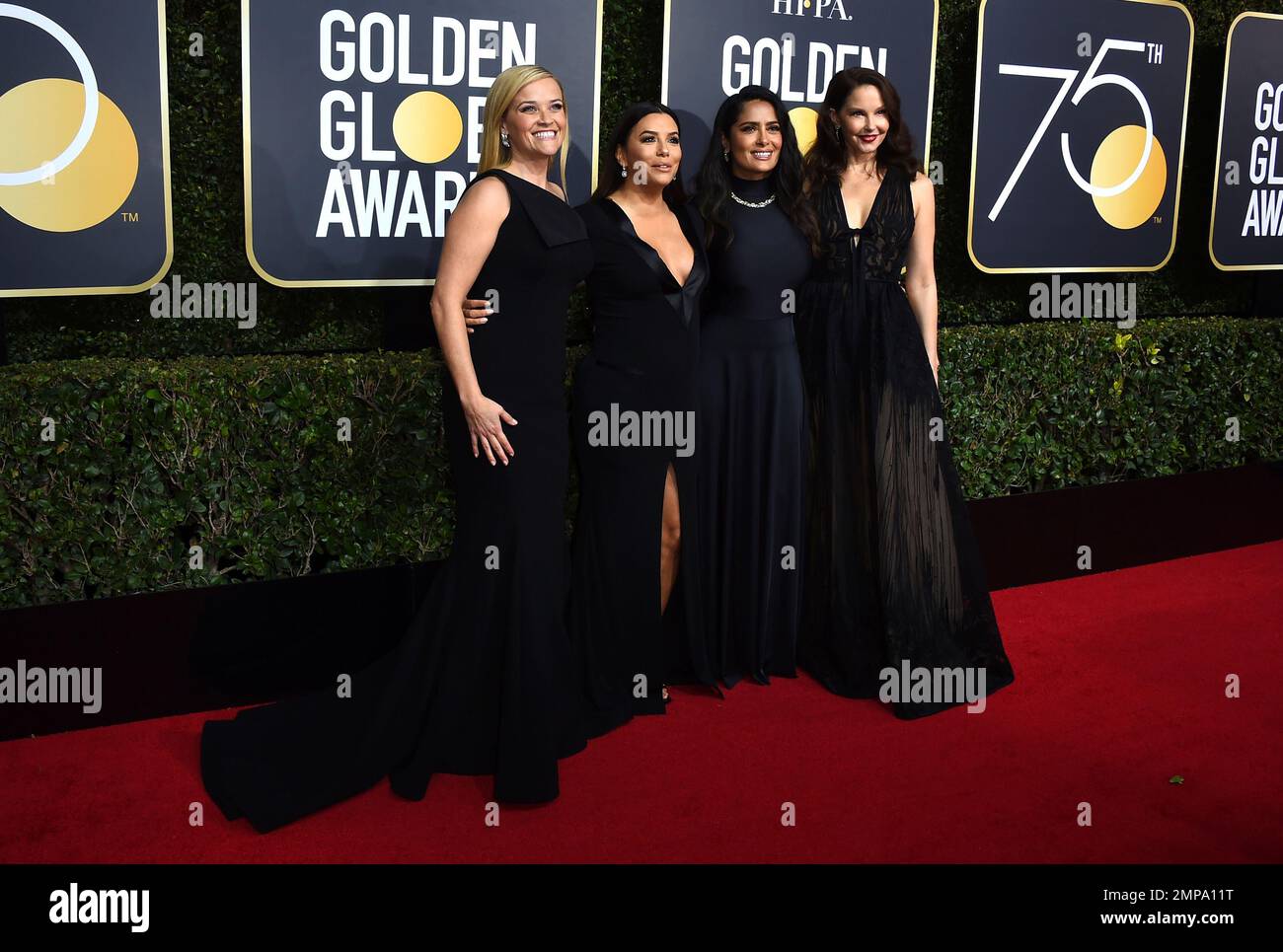 Reese Witherspoon, from left, Eva Longoria, Salma Hayek and Ashley Judd arrive at the 75th annual Golden Globe Awards at the Beverly Hilton Hotel on Sunday, Jan. 7, 2018, in Beverly Hills, Calif. (Photo by Jordan Strauss/Invision/AP) Foto Stock
