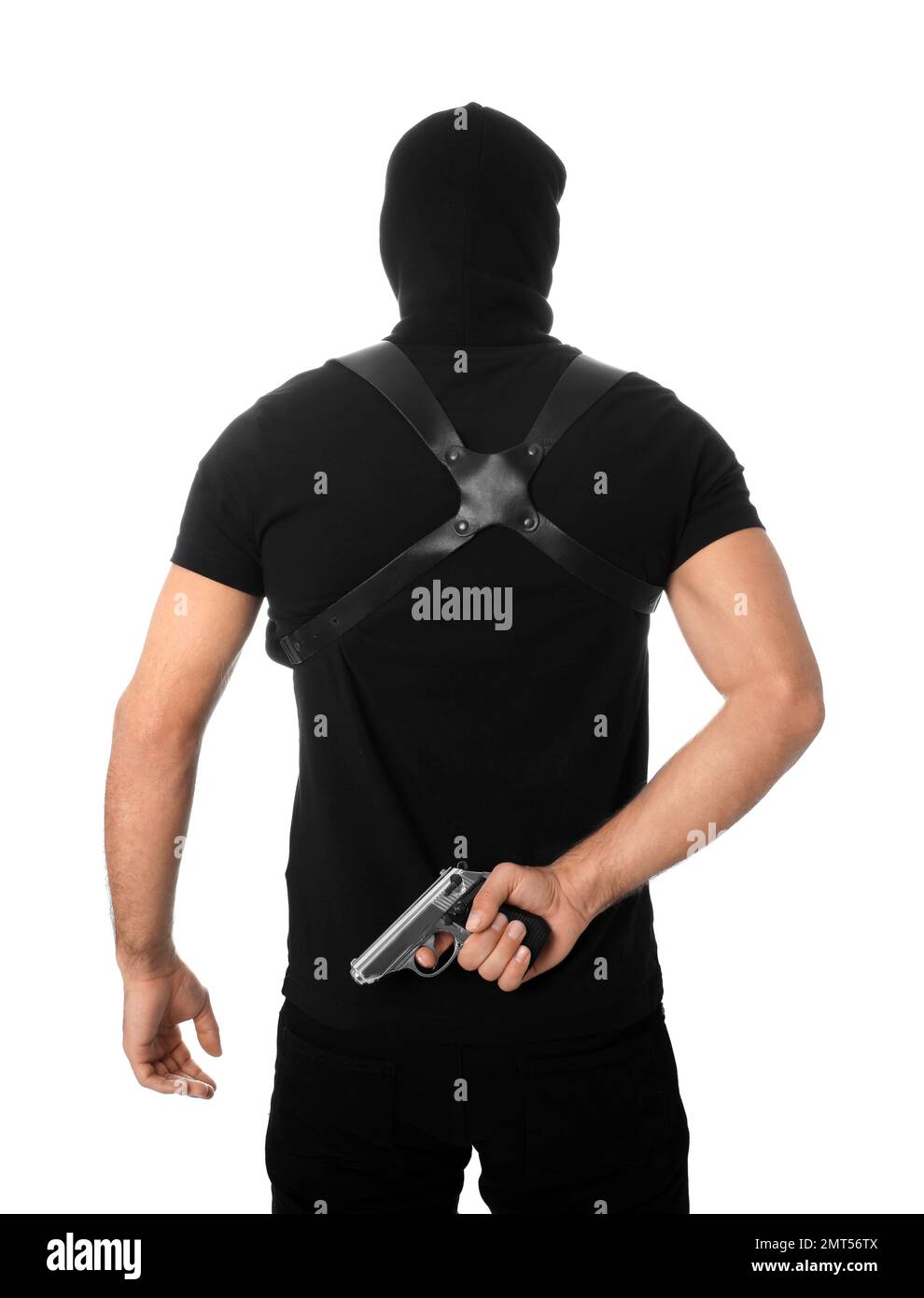 Killer professionale con pistola su sfondo bianco Foto Stock