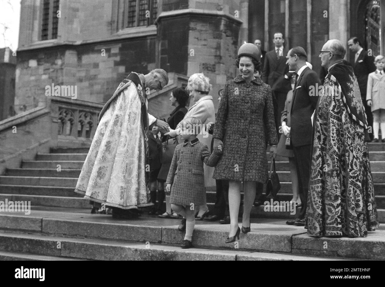 the-queen-holds-the-hand-of-her-youngest-child-five-year-old-prince
