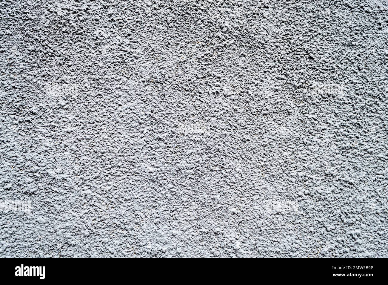 Bella parete grigio chiaro e intonacata a righe. Foto Stock