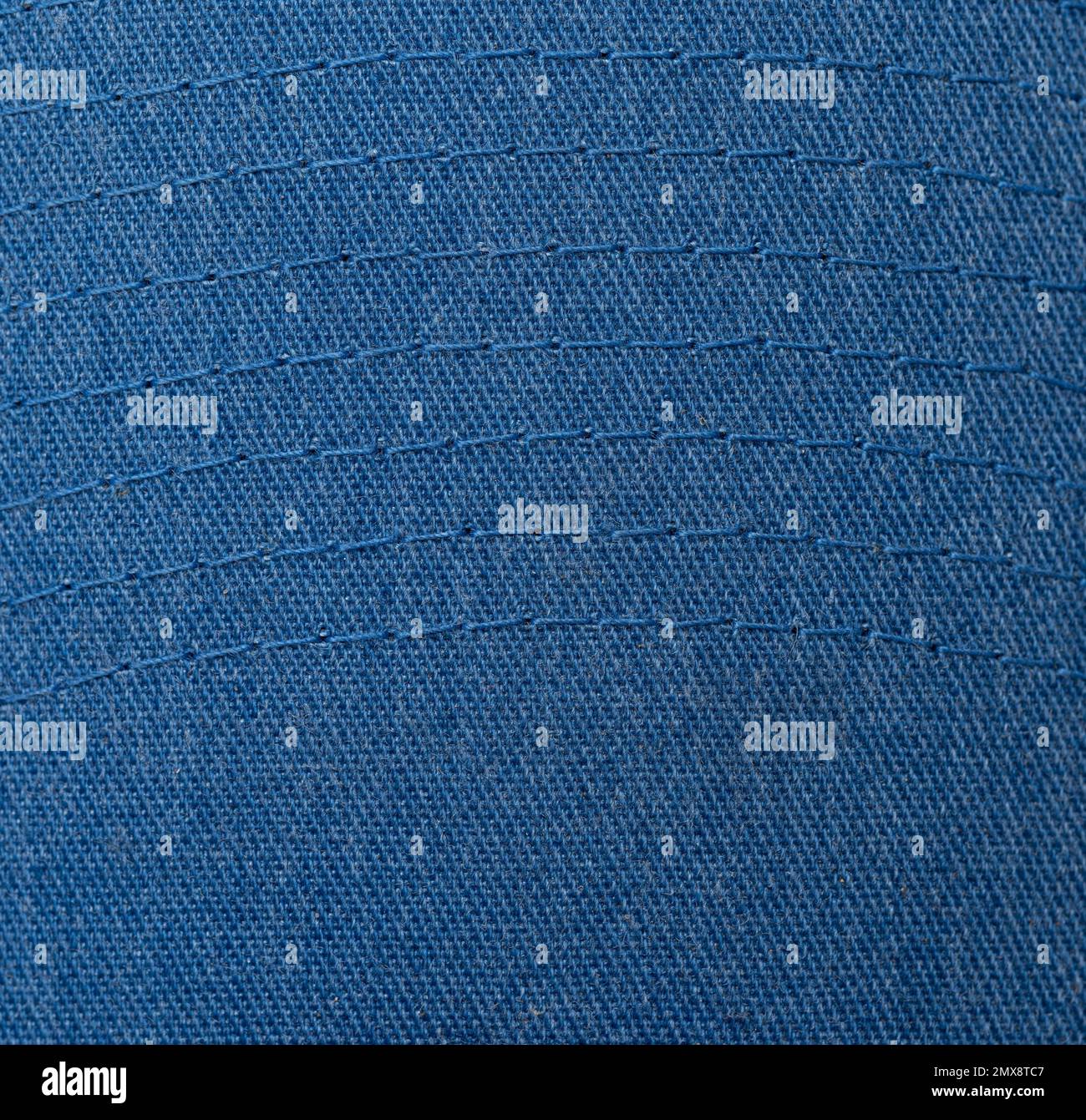 Sfondo jeans blu a righe con cuciture a forma d'onda Foto Stock