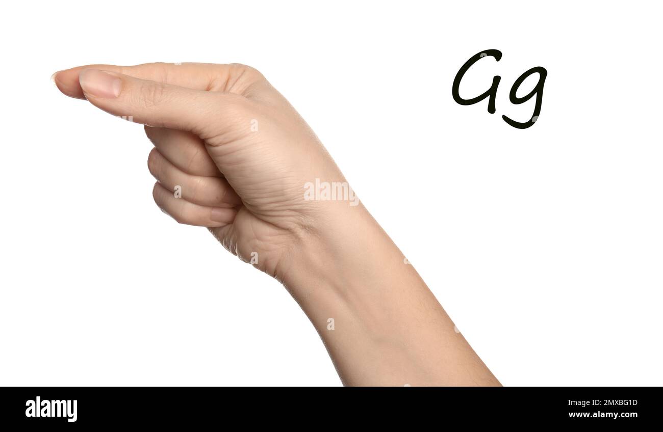 Donna che mostra la lettera G su sfondo bianco, primo piano. Lingua dei segni Foto Stock