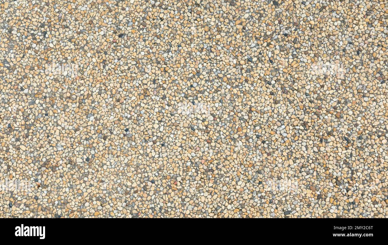 Abstract pavimentazione sfondo costituito da piccoli ciottoli annegate nel cemento Foto Stock