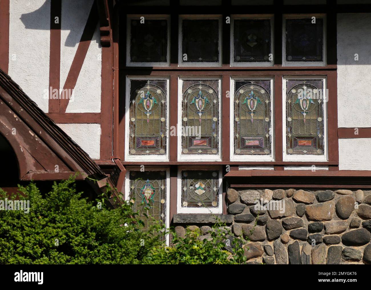Stained glass adorns the windows of a medieval revival style mansion in