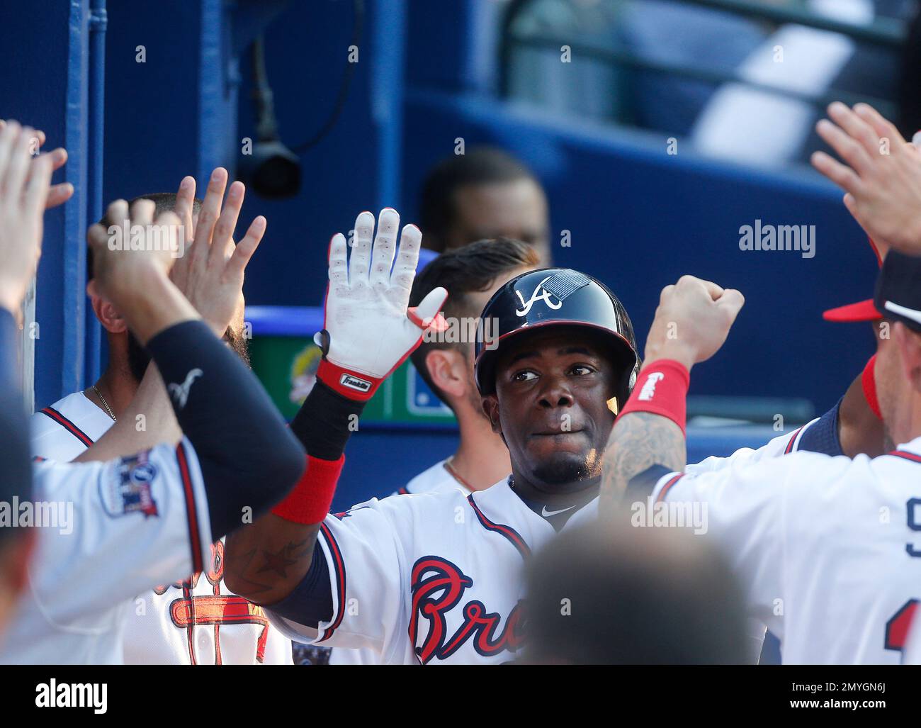 Atlanta Braves' Adonis Garcia celebrates with his teammates in the dugout after hitting a home run during the second inning of a baseball game against the Chicago Cubs on Friday, June 10, 2016, in Atlanta. (AP Photo/John Bazemore) Foto Stock