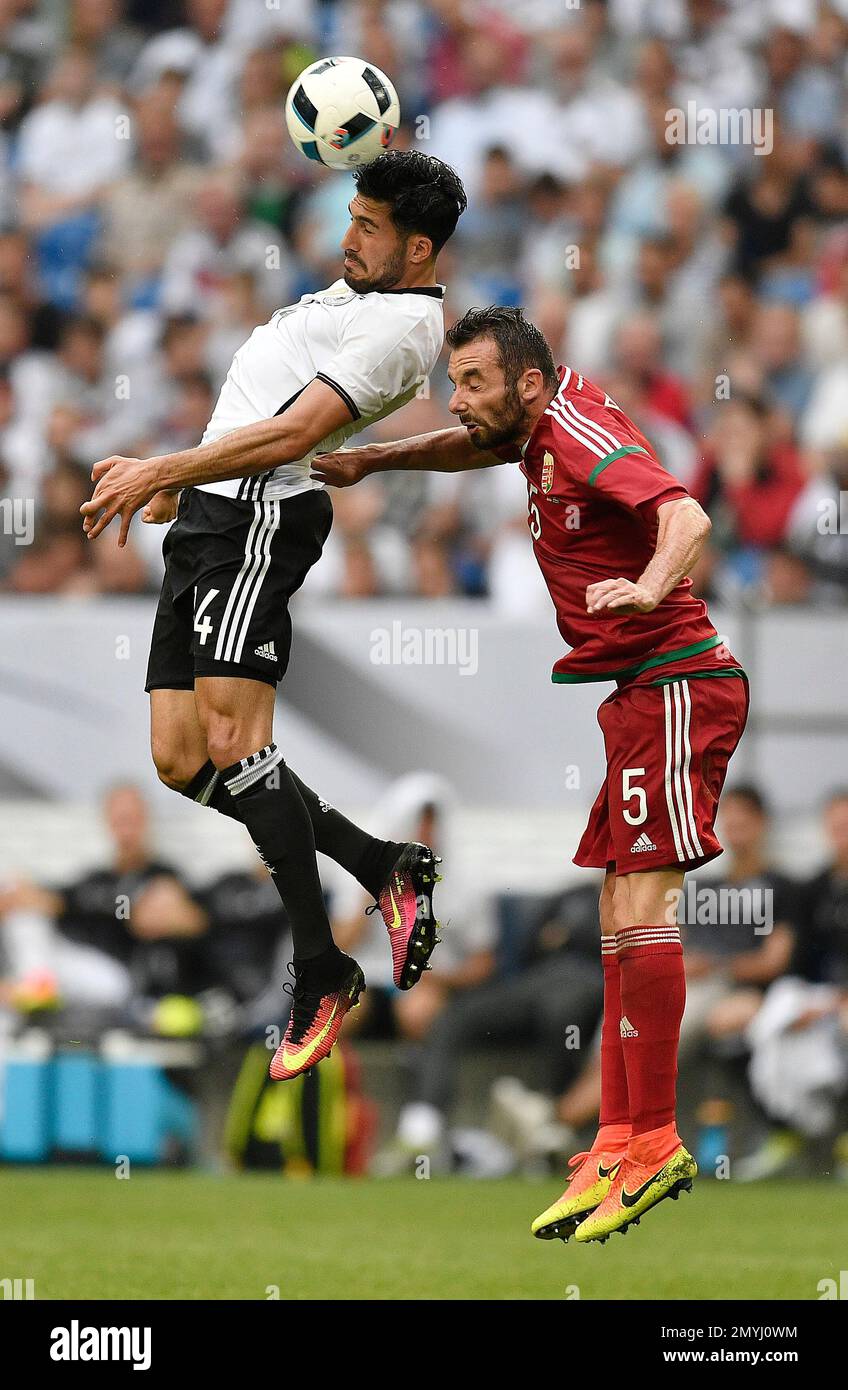 Germany’s Emre Can , left, and Hungary’s Attila Fiola challenge for the ball during the international friendly soccer match between Germany and Hungary in Gelsenkirchen, Germany, Saturday, June 4, 2016. (AP Photo/Martin Meissner) Foto Stock