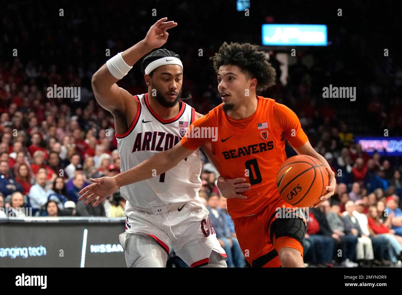 Oregon State guard Jordan Pope (0) drives against Arizona guard Kylan