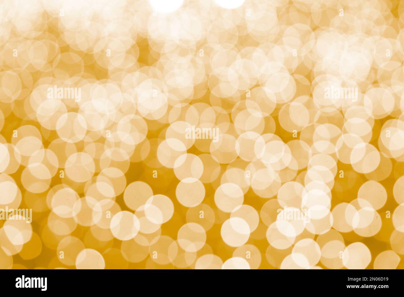 Sfondo bokeh giallo astratto. Luci bokeh di Natale rifocused sfondo sfocato. Foto Stock