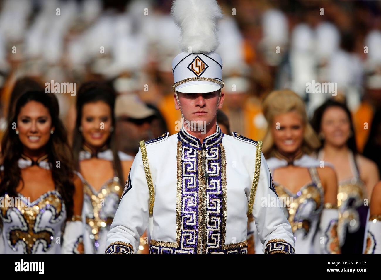 A drum major for the LSU Marching Band leads the band and the LSU