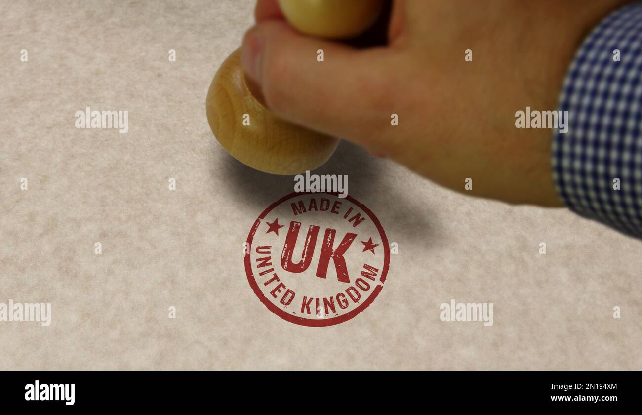 Realizzato in UK francobollo e mano di stampaggio. Concetto di fabbrica, produzione e paese di produzione. Foto Stock