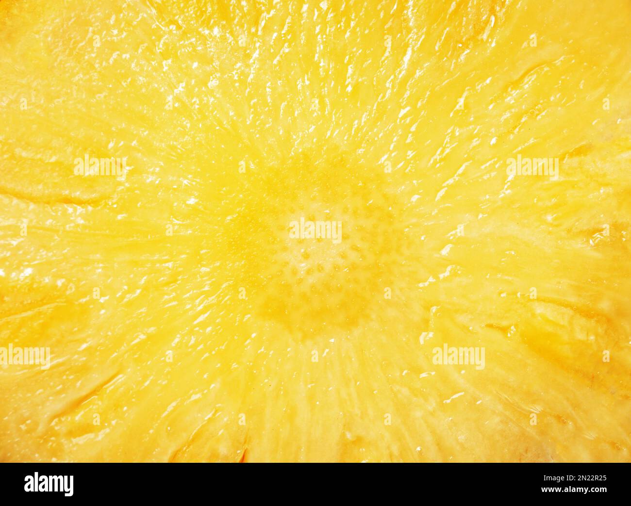 Fetta di ananas fresco succosa come sfondo, primo piano Foto Stock