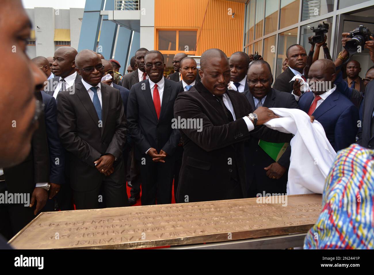Congo president Joseph Kabila, third right, unveils a placard at the