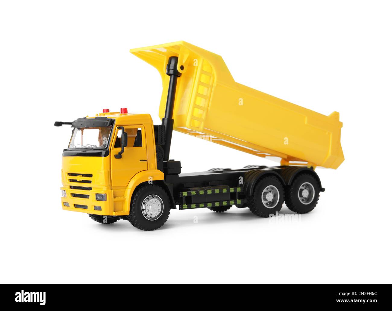 Carrello ribaltabile giocattolo giallo isolato su bianco Foto Stock