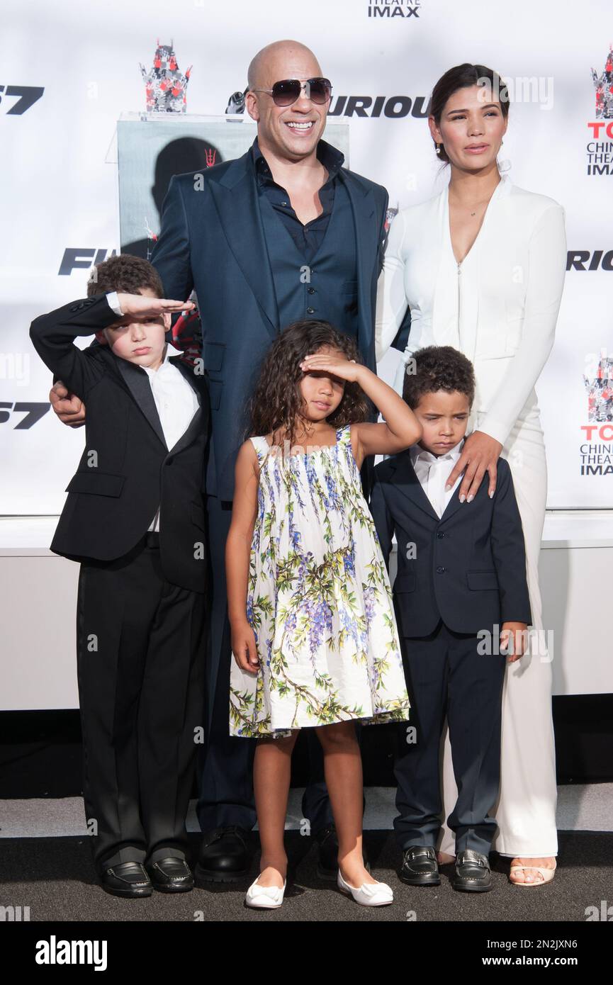Actor Vin Diesel, left, and Paloma Jimenez, with children attend the Vin Diesel Hand And Footprint Ceremony in the courtyard of the TCL Chinese Theatre on Wednesday, April 1, 2015, in Los Angeles. (Photo by Richard Shotwell/Invision/AP) Foto Stock