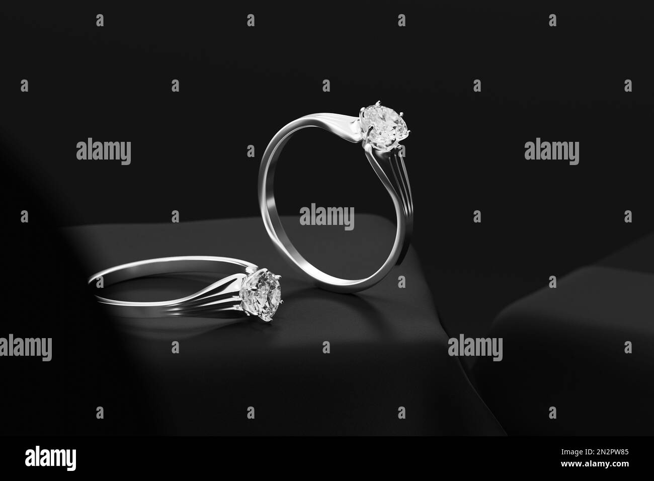 Coppia d'argento anelli diamantati su sfondo nero rendering 3D Soft focus Foto Stock
