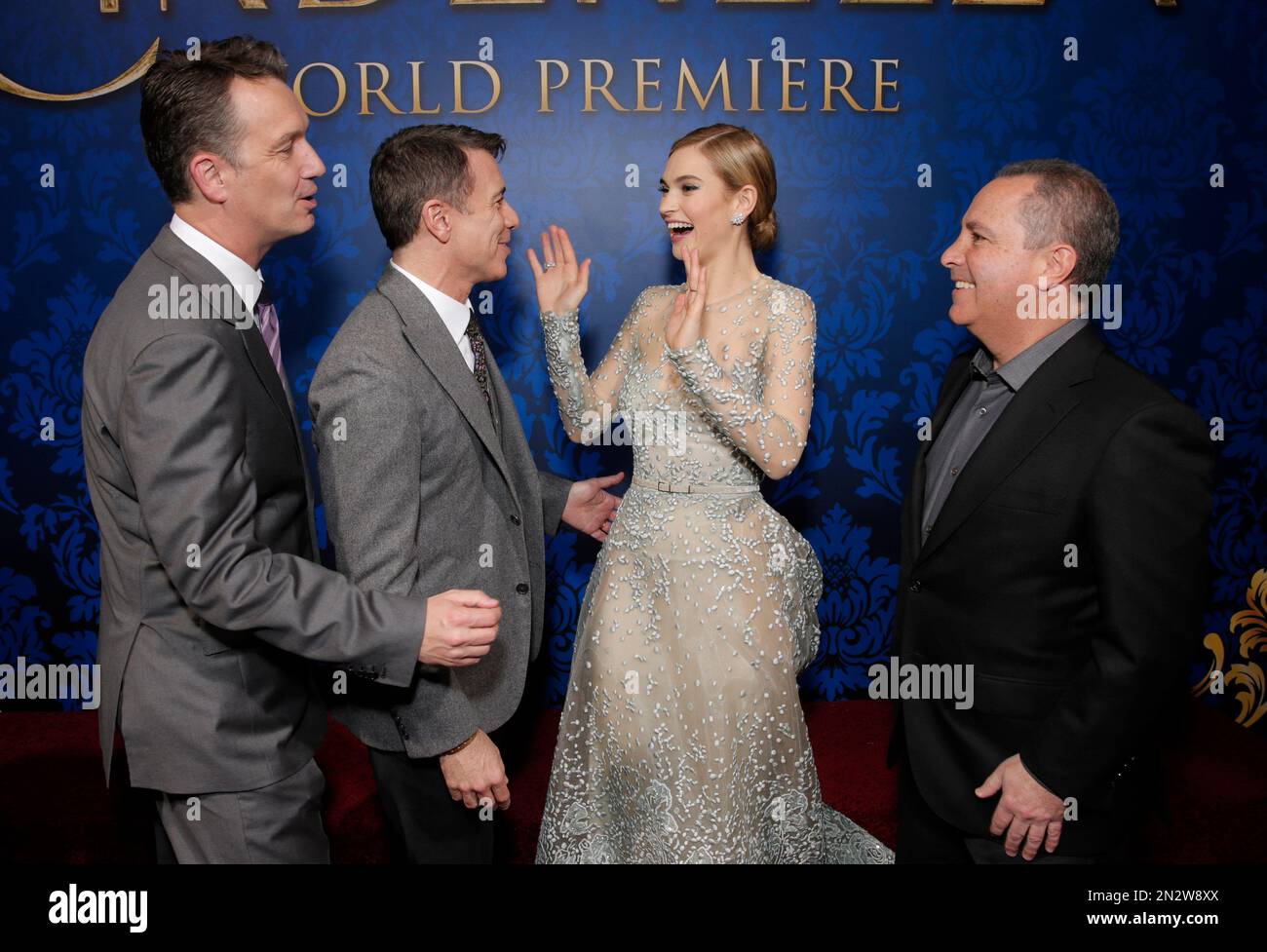 President of Walt Disney Studios Motion Picture Production Sean Bailey, Walt Disney Studios President of Marketing Ricky Strauss, actress Lily James and Walt Disney Studios President Alan Bergman attend the World Premiere Of "Cinderella" on Sunday, March 1, 2015, in Los Angeles. (Photo by Todd Williamson/Invision/AP) Foto Stock