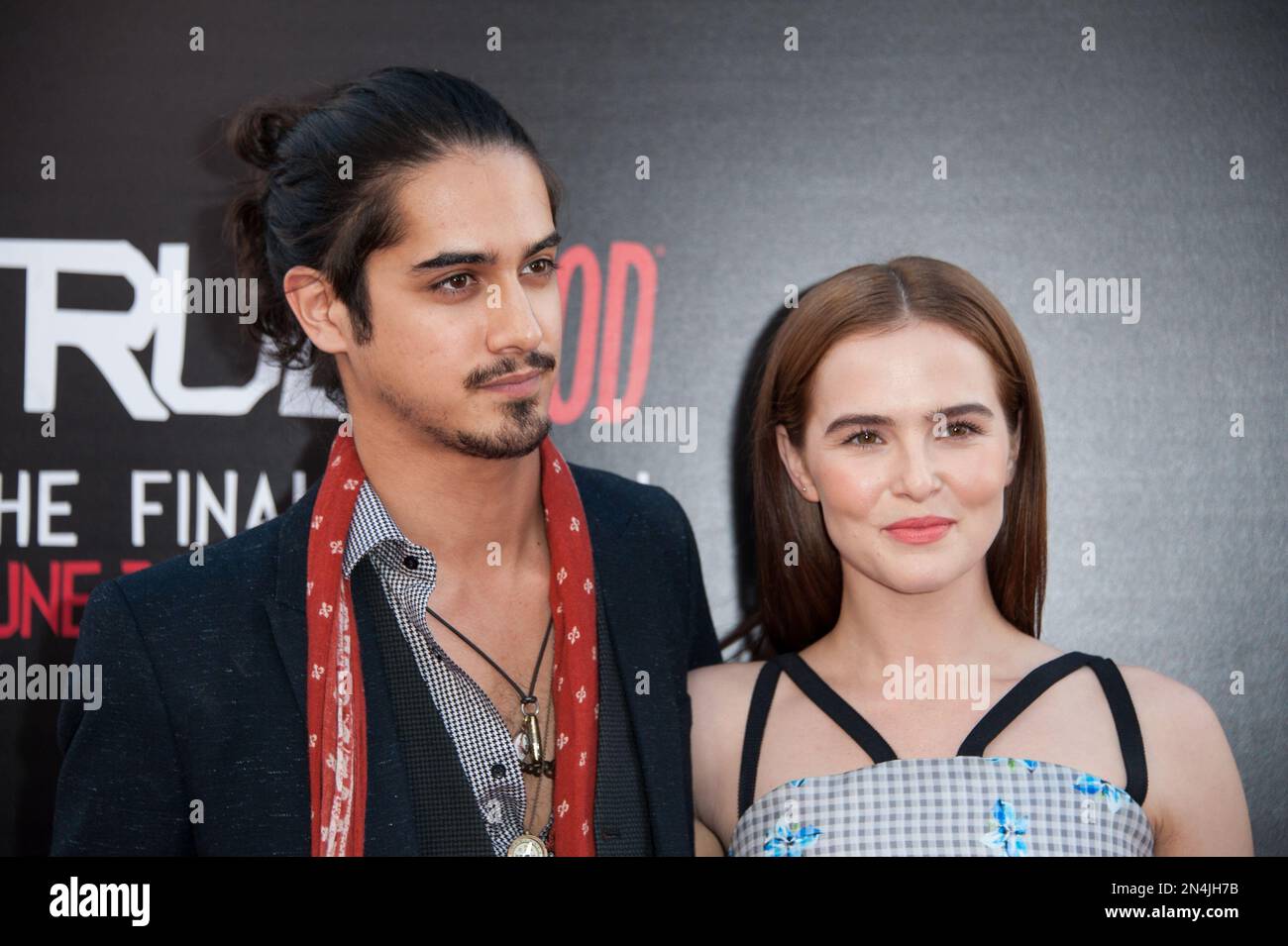 Avan Jogia, left, and Zoey Deutch arrive at the Los Angeles premiere of the 7th and final season of "True Blood" at the TCL Chinese Theatre on Tuesday, June 17, 2014. (Photo by Richard Shotwell/Invision/AP) Foto Stock