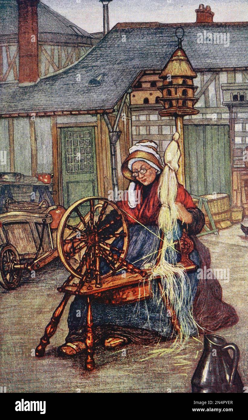 Donna che lavora una ruota che gira in Normandia, Francia, circa 1905 Foto Stock