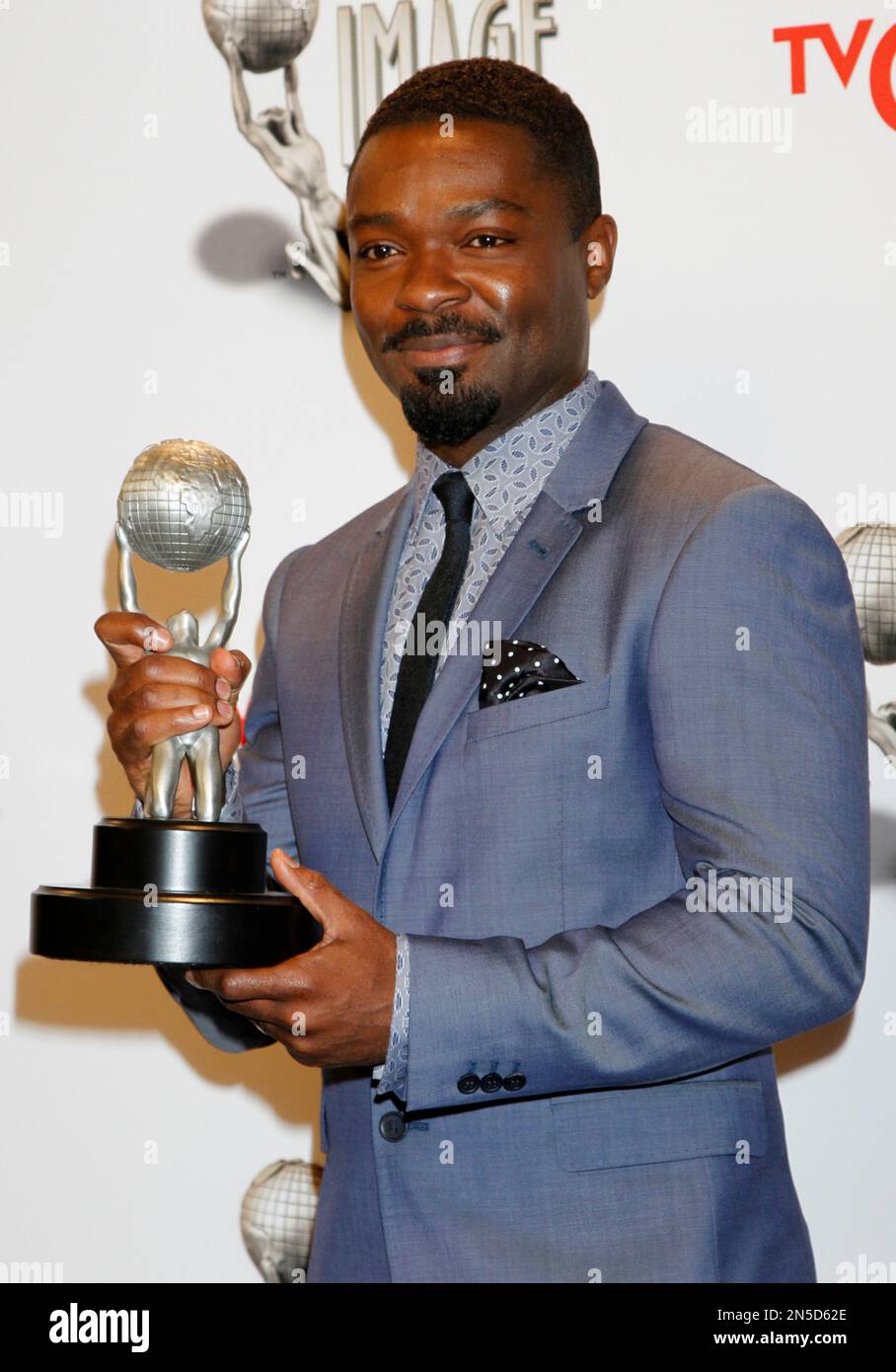 David Oyelowo poses in the press room with the award for outstanding supporting actor in a motion picture for "Lee Daniels' The Butler" at the 45th NAACP Image Awards at the Pasadena Civic Auditorium on Saturday, Feb. 22, 2014, in Pasadena, Calif. (Photo by Arnold Turner/Invision/AP) Foto Stock