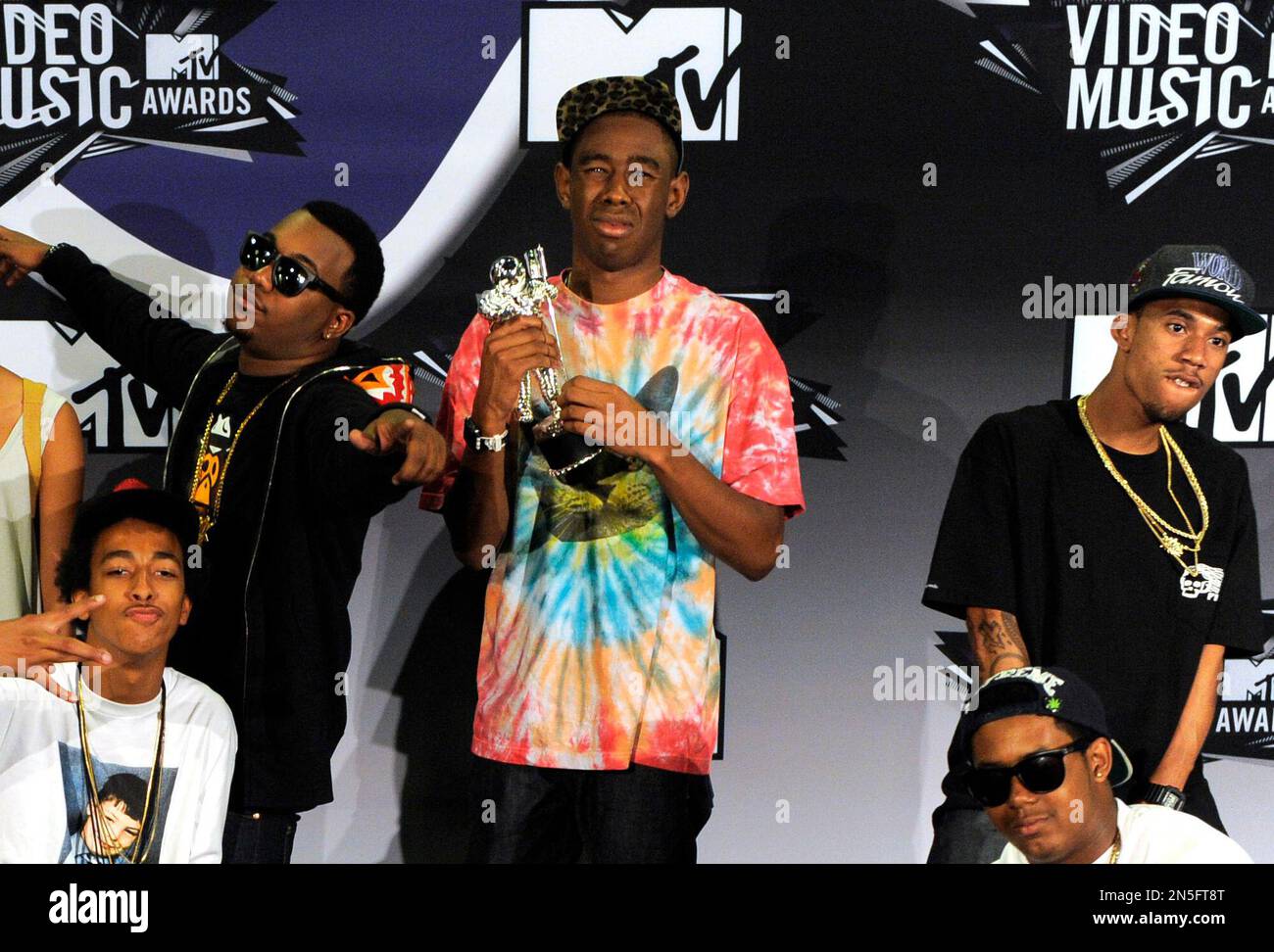 FILE - In this Aug. 28, 2011 file photo, Tyler, The Creator, center ...