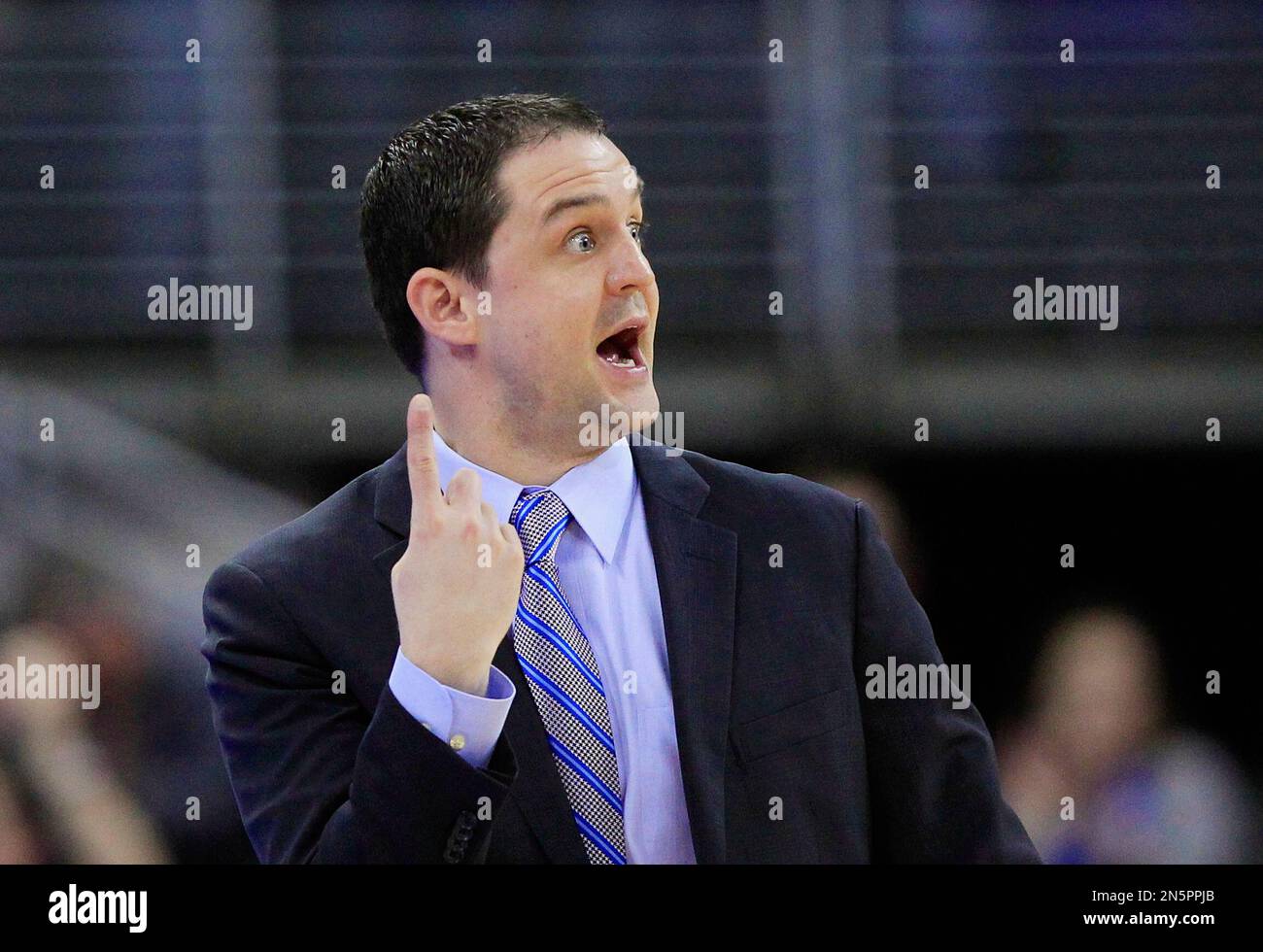 Butler coach Brandon Miller signals to his players in the first half of an NCAA college basketball game against Creighton, in Omaha, Neb., Tuesday, Jan. 14, 2014. (AP Photo/Nati Harnik) Foto Stock
