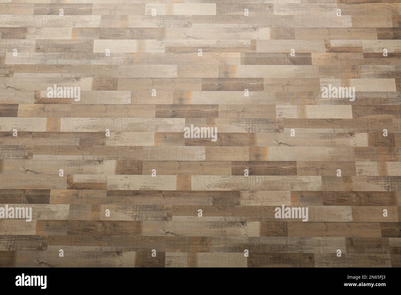 Laminato di legno come sfondo, vista dall'alto. Rivestimento del pavimento Foto Stock