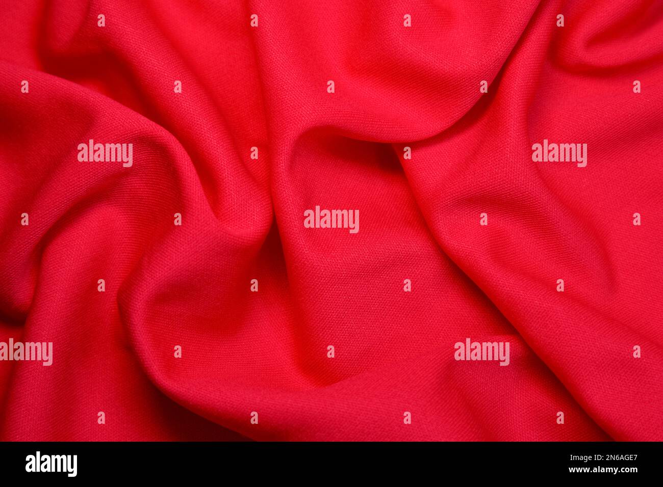 Sfondo tessuto rosso. Tessuto rosso onde sfondo texture. Tessuto in tessuto rosso. Foto Stock