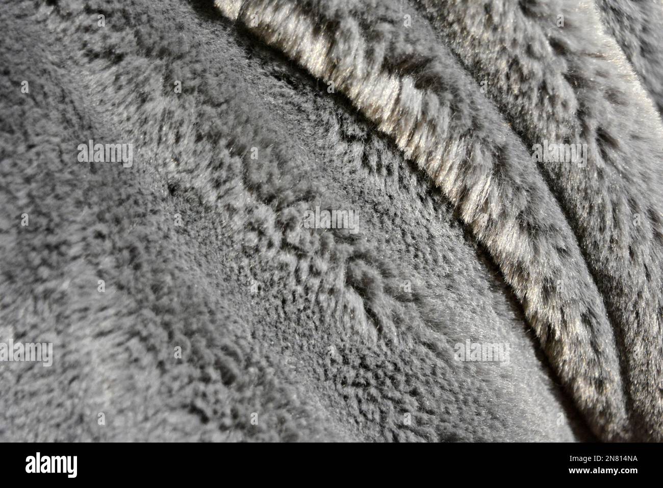 Pelliccia sfondo morbido, sintetico, non naturale grigio peluche. Foto Stock