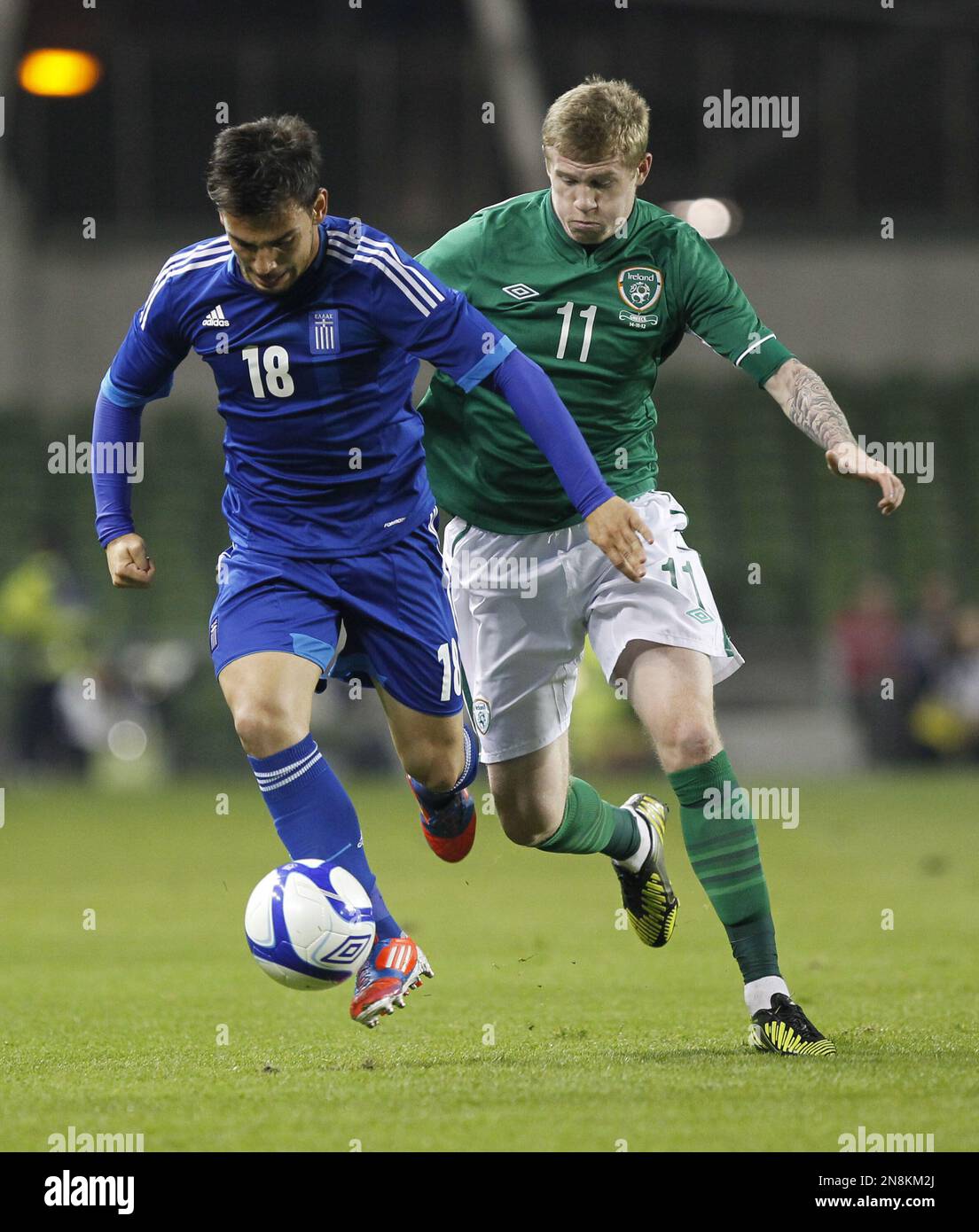 Greece's Sotiris Ninis, left, wins the ball from Republic of Ireland's James McClean during their soccer international at the Aviva Stadium, Dublin, Ireland, Wednesday, Nov. 14, 2012. (AP Photo/Peter Morrison) Foto Stock