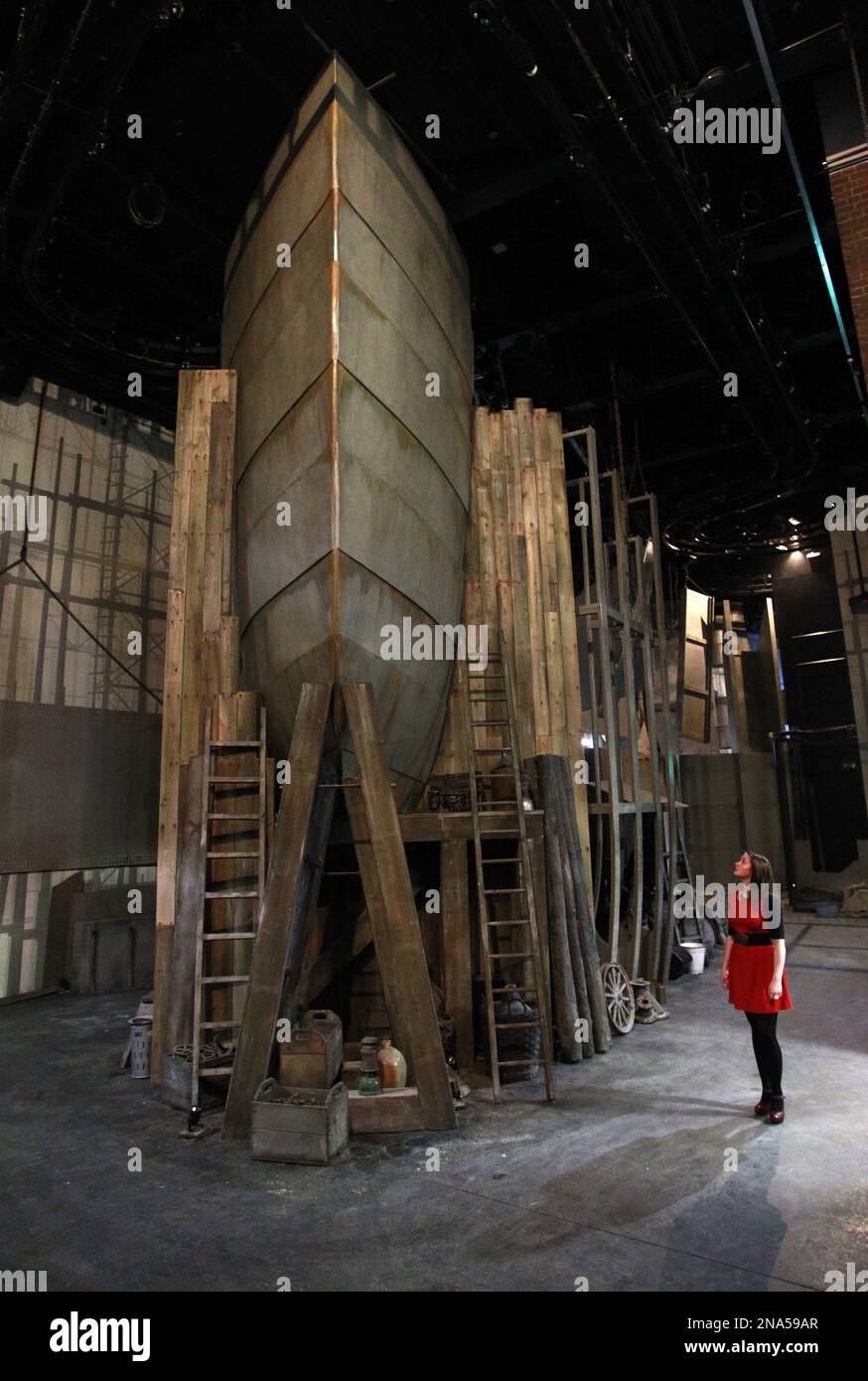 in-this-photo-of-tuesday-march-13-2012-a-woman-looks-at-the-hull-of-a