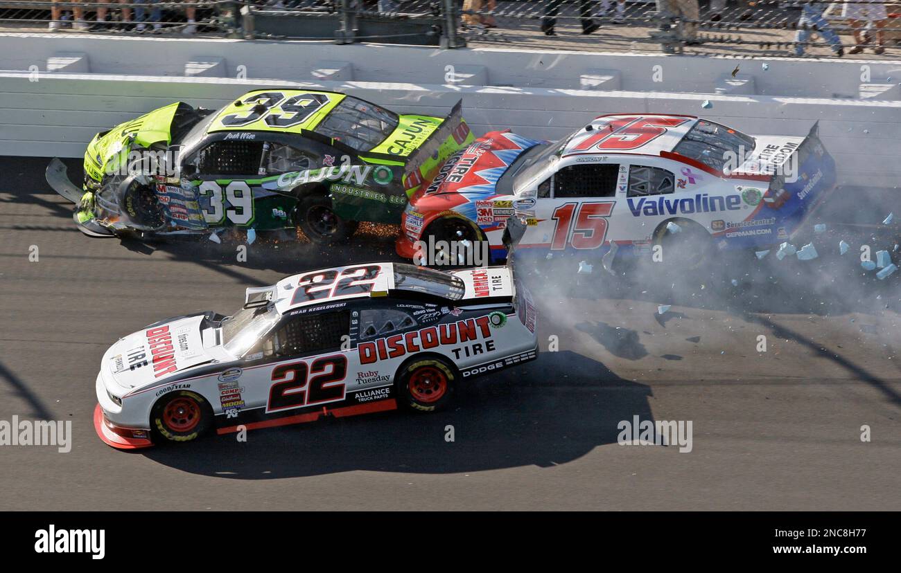 Drivers Brad Keselowski (22), Josh Wise (39), and Todd Bodine (15) crash during the DRIVE4COPD 300 NASCAR Nationwide series auto race at Daytona International Speedway in Daytona Beach, Fla., Saturday, Feb. 19, 2011. (AP Photo/Lynne Sladky) Foto Stock