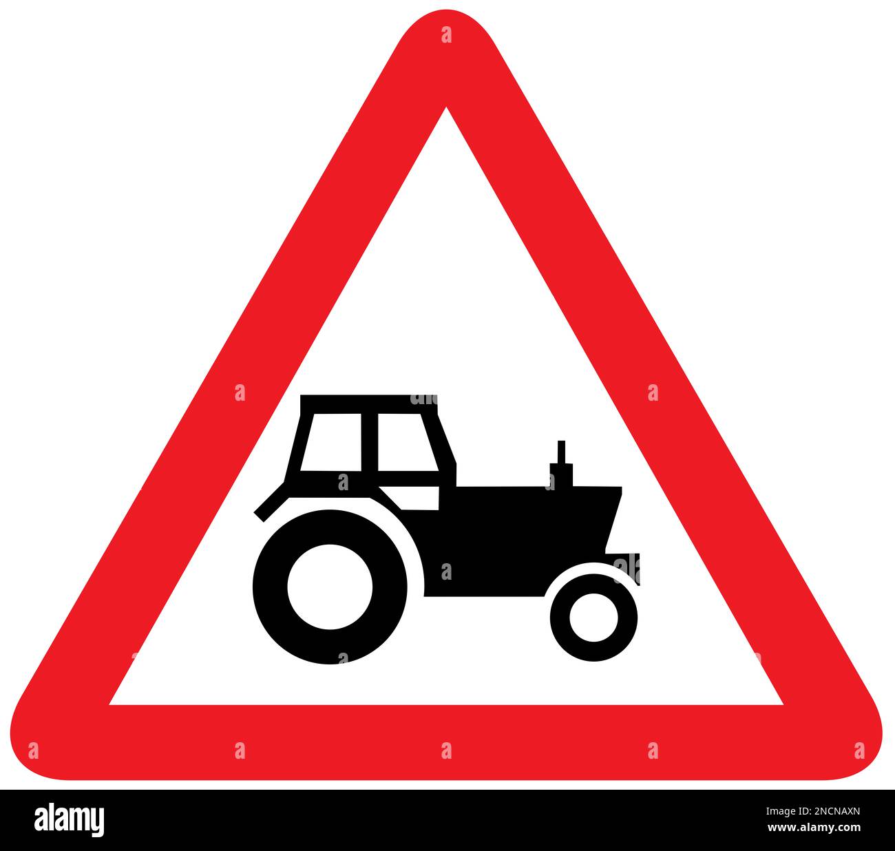 È probabile che i veicoli agricoli si trovi in strada davanti al segnale stradale britannico Foto Stock