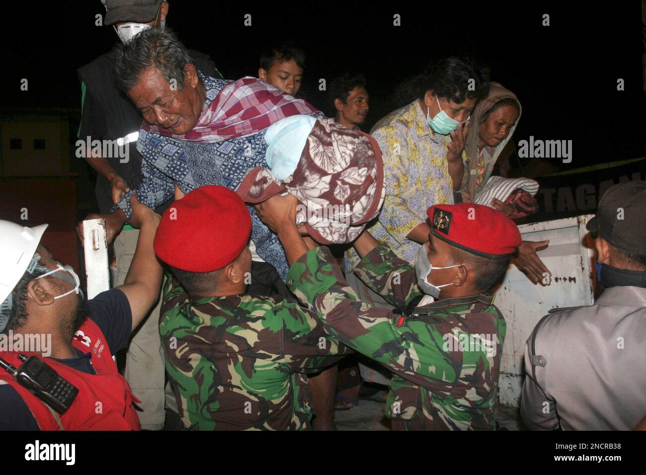 Indonesian Soldiers Evacuate Villagers From Their Homes Following ...