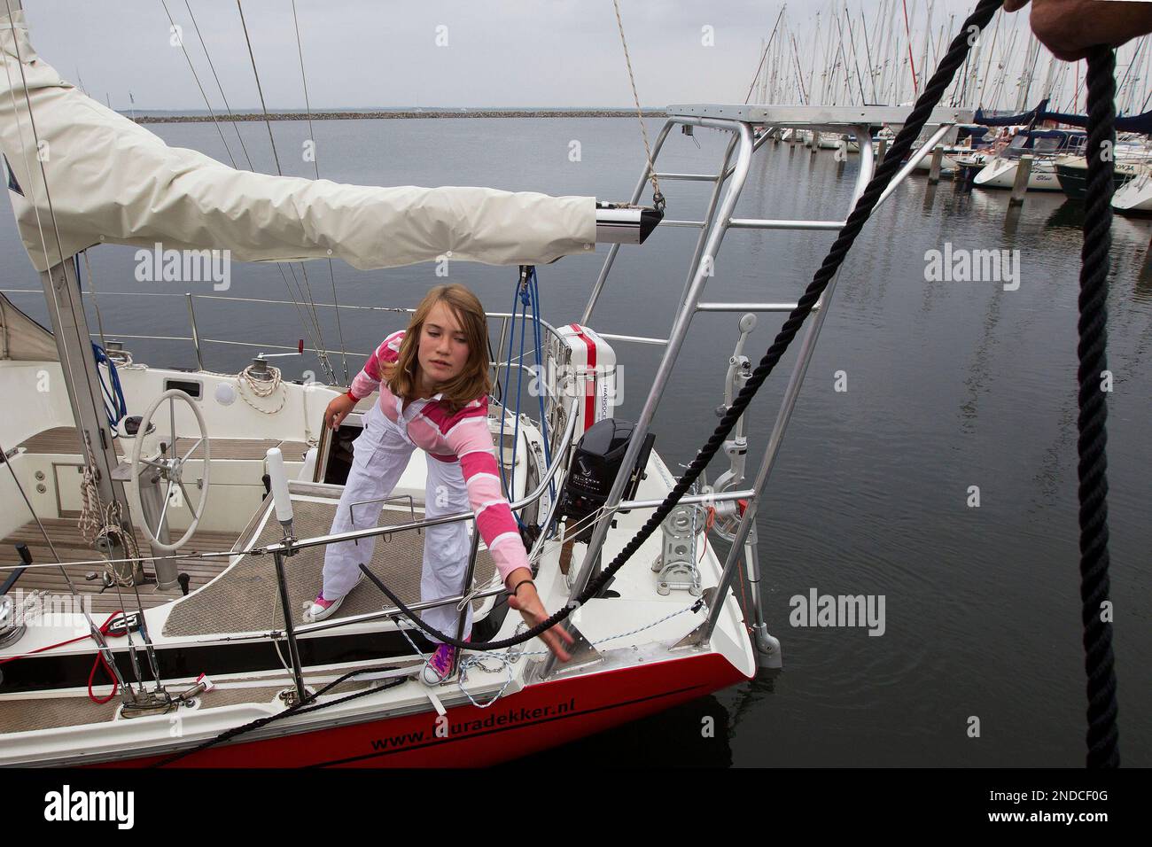 Laura Dekker poses for the media on her boat Guppy in Den Osse, south ...