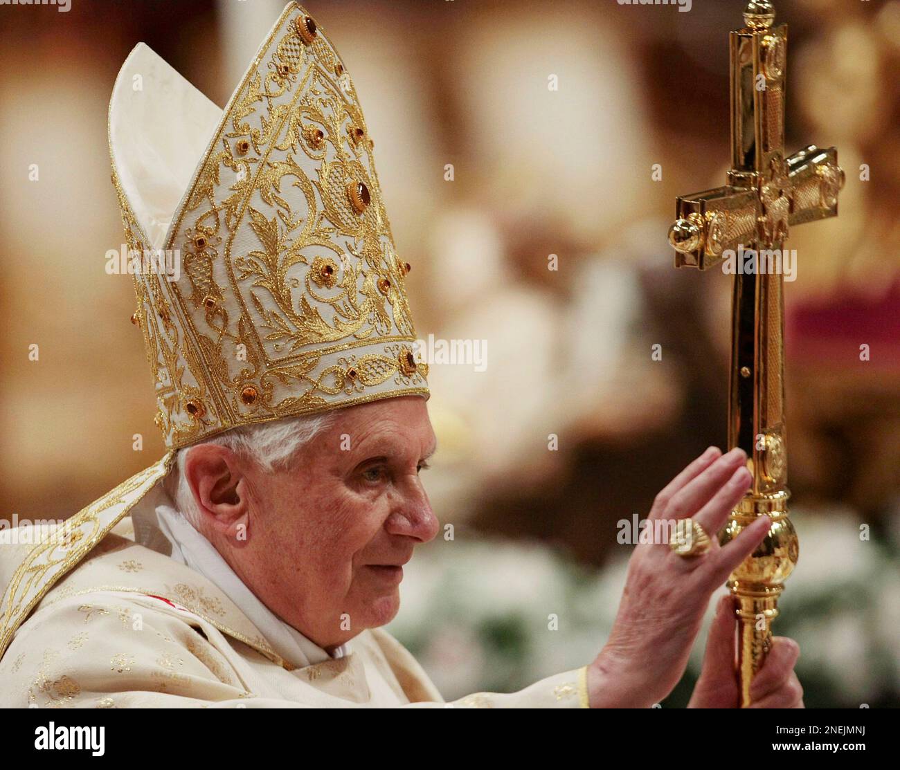 Pope Benedict XVI greets the faithful as he arrives to celebrate ...
