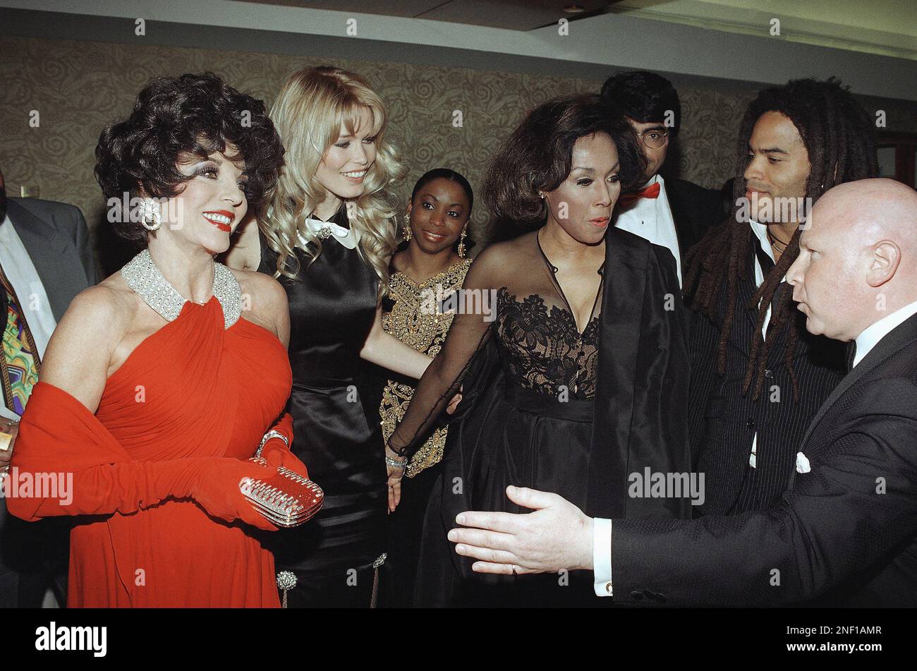 Actress Joan Collins, from left, super model Claudia Schiffer, actress