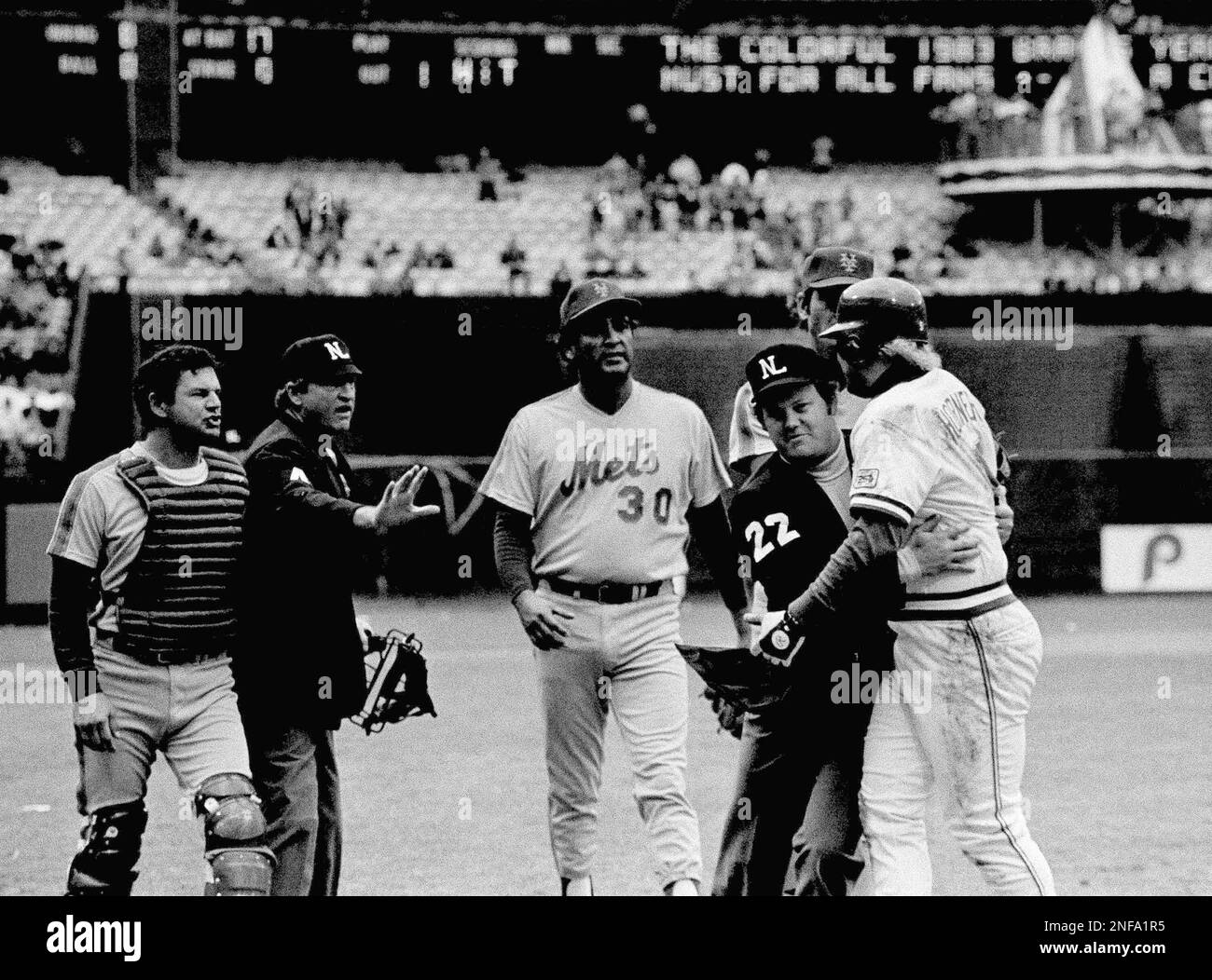 Umps Satch Davidson (4) and Joe West (22) tell Atlanta Braves Bob ...