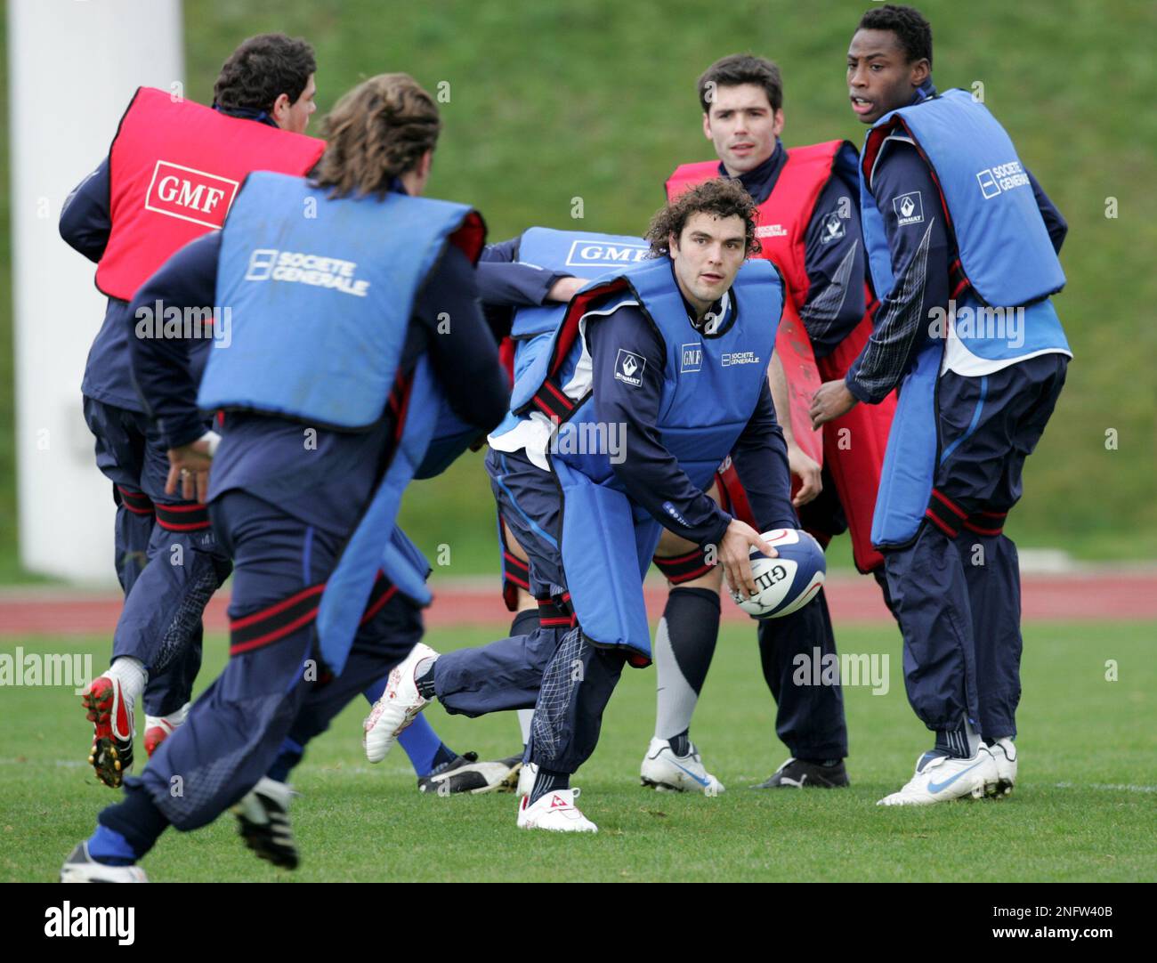 french-rugby-team-player-julien-tomas-center-prepares-to-pass-the