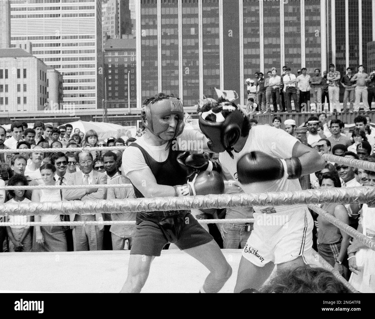 American boxer Ray "Boom Boom" Mancini, left, shows a lunch time crowd in  New York, Sept. 7, 1983, how he will defend his WBA lightweight title  against Peru's Orlando Romero, on Sept.
