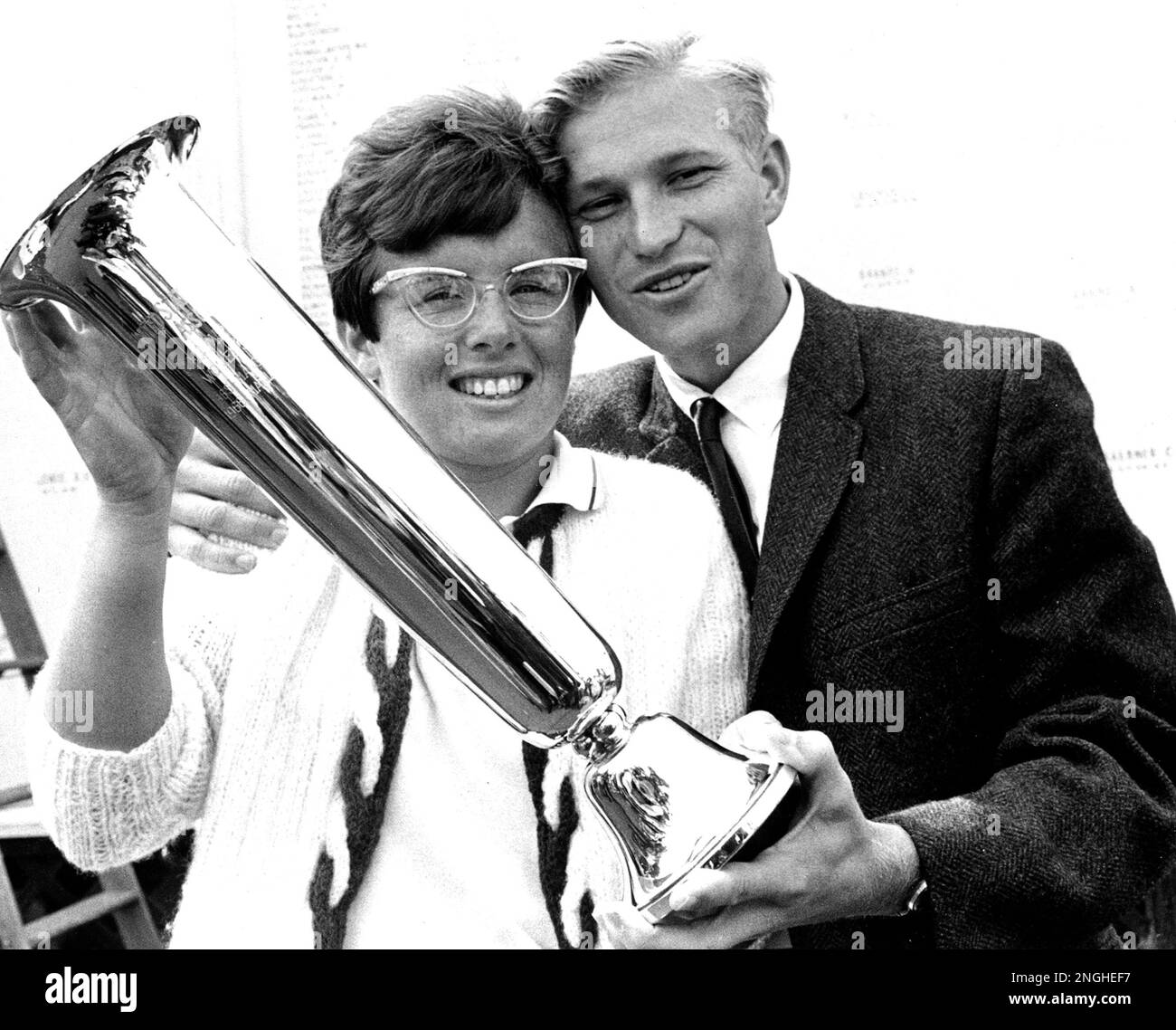 Billie Jean King, of Long Beach, Ca., U.S.A., holds her trophy as she is  congratulated by her husband, Larry King, after winning the U.S. National  tennis championships at Forest Hills, Queens, N.Y.,