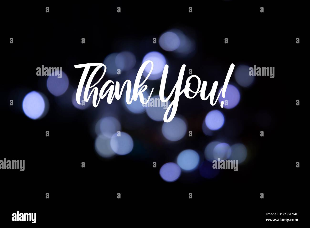 Background con le parole grazie! su sfondo sfocato Foto Stock