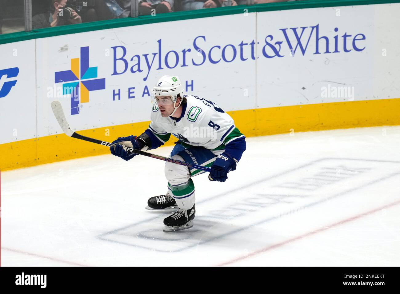 Vancouver Canucks right winger Conor Garland (8) skates during an NHL hockey game against the Dallas Stars on Saturday, March 26, 2022, in Dallas. (Matt Patterson via AP) Foto Stock