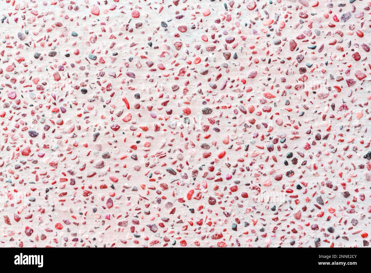 Foto di sfondo terrazzo rosa. Motivo senza giunture sul terrazzo. Struttura vettoriale del pavimento a mosaico costituita da frammenti di pietra, trucioli di marmo, granito Foto Stock