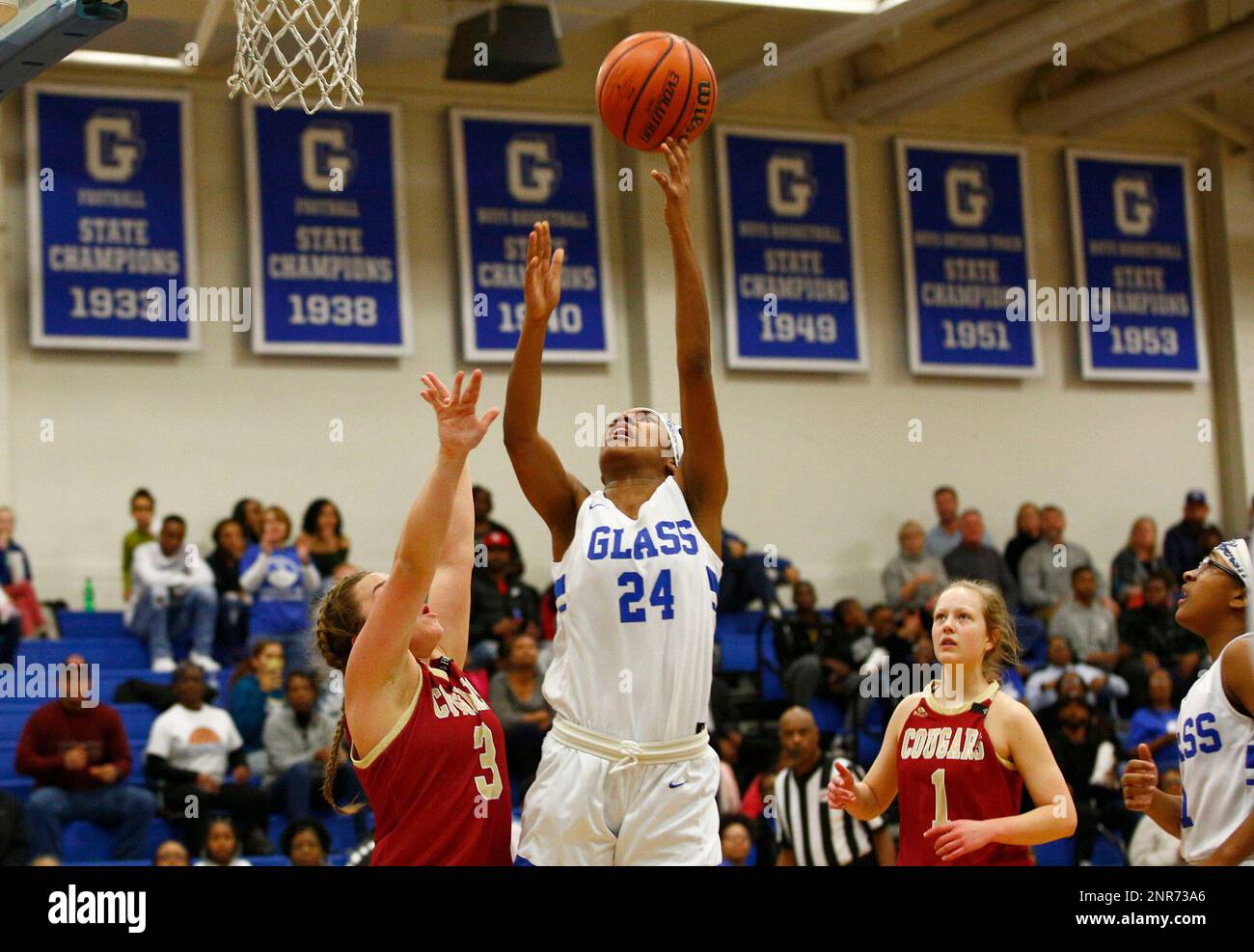 E.C. Glass' Mya Hamlet reaches for the ball during the Region 4D girls basketball championship game in Lynchburg on Friday, February 28, 2020. (Taylor Irby/The News & Advance via AP) Foto Stock